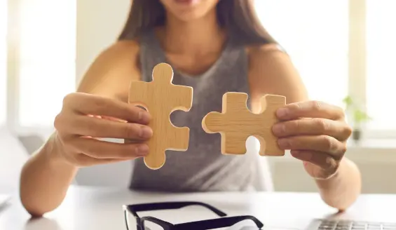 A girl holding a jigsaw puzzle